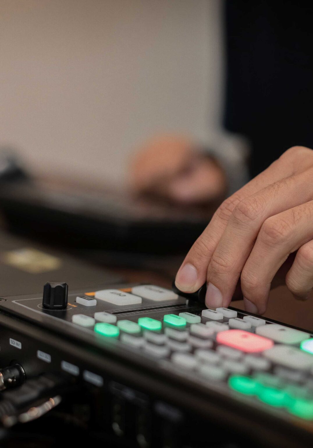 A man operates a audio mixer