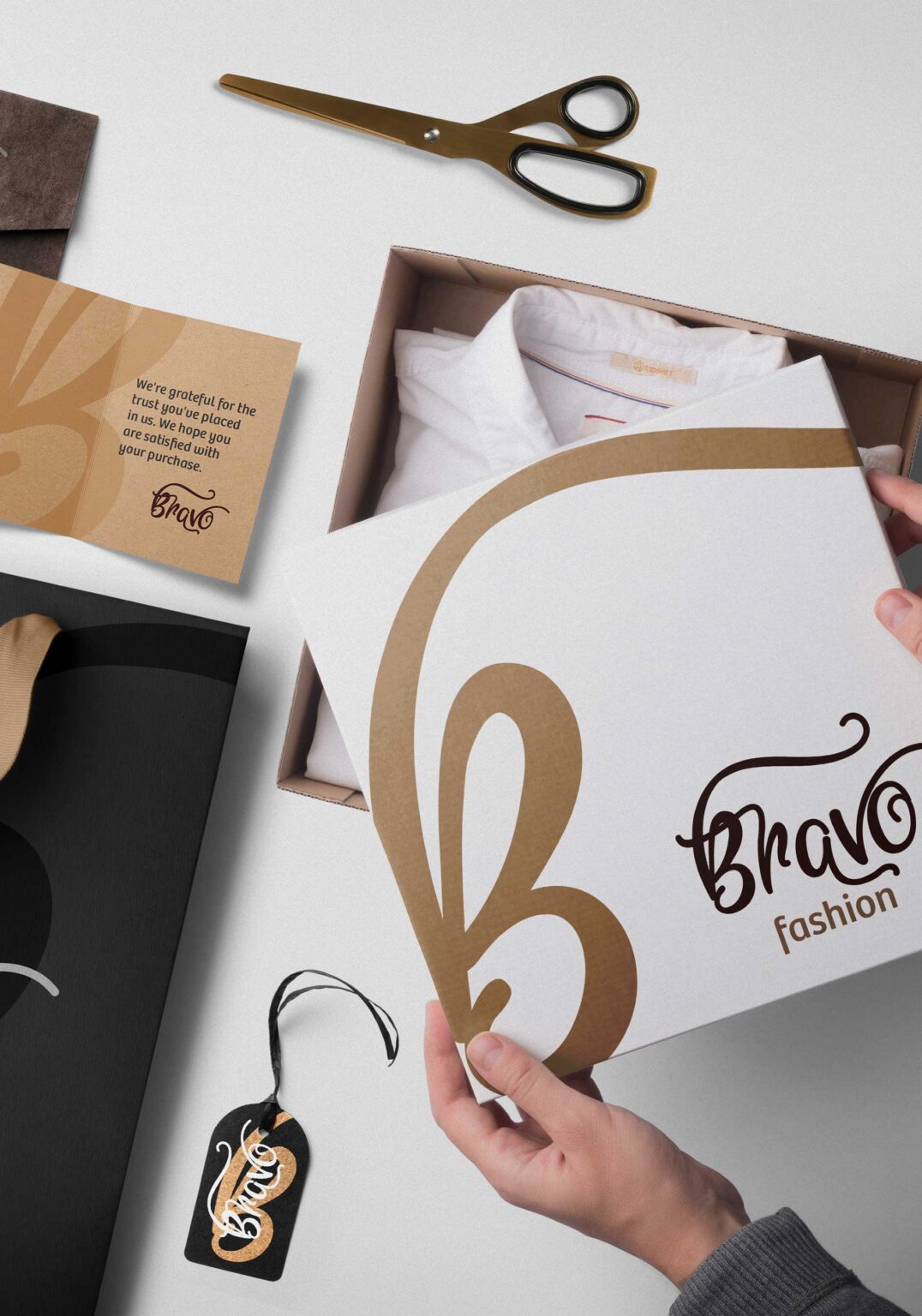 A white box with the "Bravo Fashion" logo is being opened
